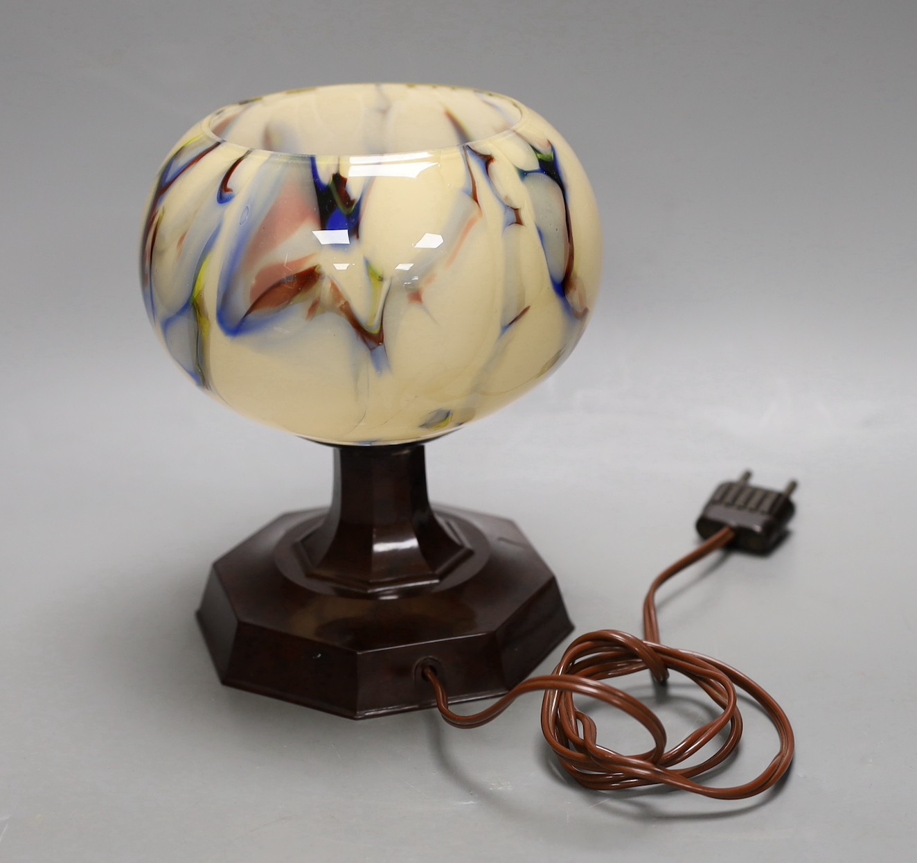 An Art Deco bakelite and glass lamp. 18cm high